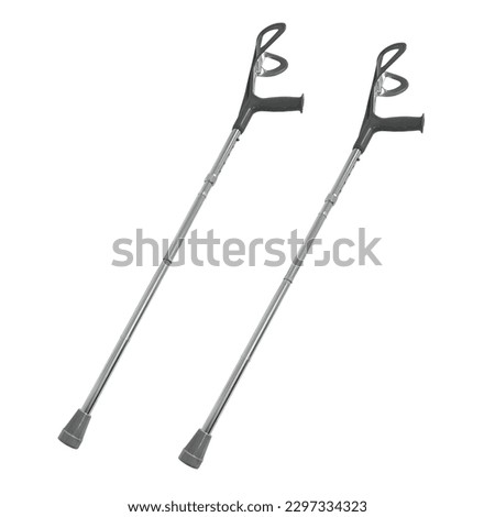 Crutches isolated on white background. Medical special equipment, walkers or walking-sticks to assist in the movement and care of disabled and elderly people. Photo of a pair of crutches Royalty-Free Stock Photo #2297334323