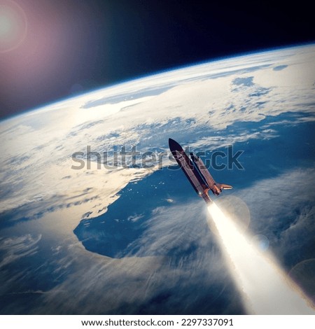 Rocket above the earth. The elements of this image furnished by NASA.

