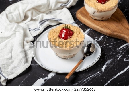 Strawberry magnolia. Magnolia dessert in bowl with cream and strawberry