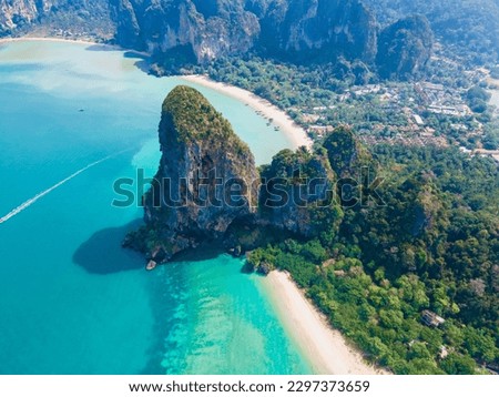 Railay Beach Krabi Thailand, the tropical beach of Railay Krabi, view from a drone of idyllic Railay Beach in Thailand in the evening at susnet with a cloudy sky Royalty-Free Stock Photo #2297373659