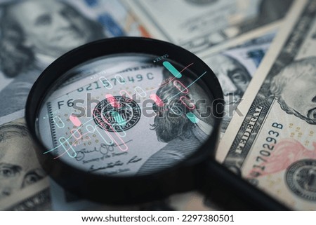 Stock market chart inside magnifier glass on Benjamin Franklin face of USD banknote for focus and analysis currency exchange and global trade forex concept. Royalty-Free Stock Photo #2297380501
