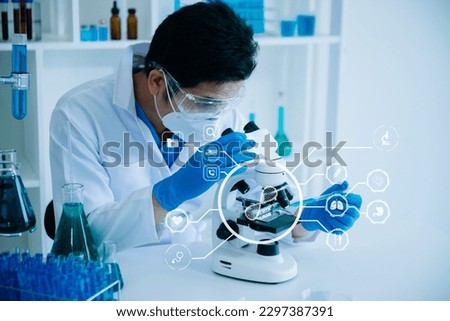 DNA molecule testing concepts. The doctor in a mask examines DNA molecules on the chemical laboratory with virtual icon
 Royalty-Free Stock Photo #2297387391