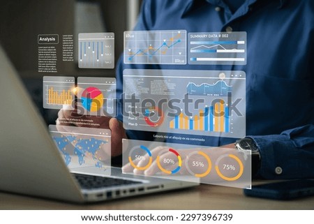 The analyst works on a laptop showing data business analysis and Data Management System with KPI and metrics connected to the database for technology finance operations Data Analytics Statistics. Royalty-Free Stock Photo #2297396739