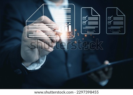 The technology of signings electronic documents in the future. Businessman holding tablet on hand with sign virtual screen an electronic signature approved on an electronic document.