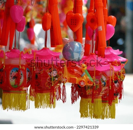 Close up of colourful toys hanging in street stall, Hanoi, Vietnam. High quality photo
