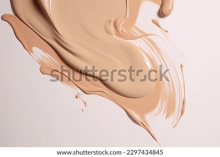 Liquid foundation strokes on light color background, Makeup creamy texture, Skin tone cosmetic product smear smudge swatch Royalty-Free Stock Photo #2297434845