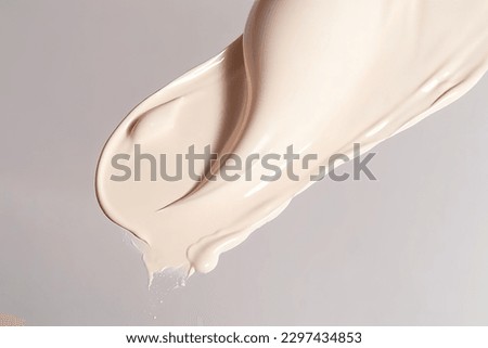 Liquid foundation strokes on light color background, Makeup creamy texture, Skin tone cosmetic product smear smudge swatch
