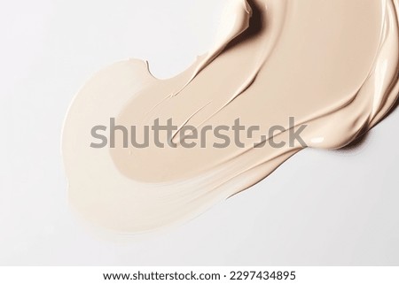 Liquid foundation strokes on light color background, Makeup creamy texture, Skin tone cosmetic product smear smudge swatch Royalty-Free Stock Photo #2297434895