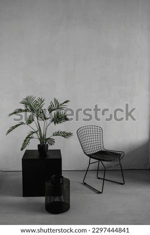 dark armchair in vintage style on gray textured background. interior in the loft