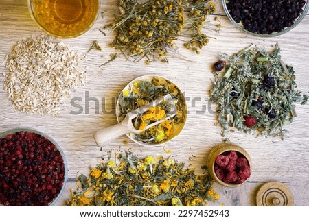 Dry organic ecological herbal tea, berries with female hands. Antistress, relaxation wellbeing healthy view. Alternative medicine. Mental health, healing. Vitamin nutrition, treatment. Immune system. Royalty-Free Stock Photo #2297452943