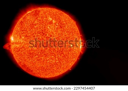The sun in space on a dark background. Elements of this image furnished NASA. High quality photo Royalty-Free Stock Photo #2297454407