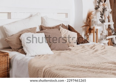 Home bedroom closeup, plant flower pot near bed. Room natural decoration at house interior, nobody at modern apartment. Bedding blanket decor at minimalistic furniture design.boho style decoration Royalty-Free Stock Photo #2297461265