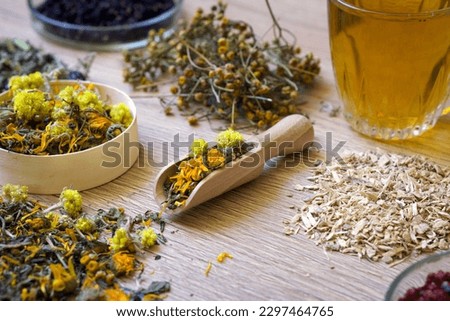 Dry organic ecological herbal tea, berries in a wooden dishes. Antistress, relaxation wellbeing healthy view. Alternative medicine. Mental health, healing. Vitamin nutrition, treatment. Immune system.