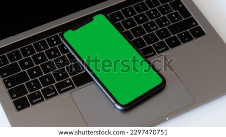 A Green Screen Smartphone on Laptop
