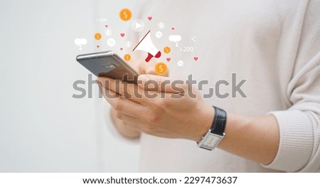 close up adult man hand hold smartphone to use affiliated marketing on web with virtual icon to announce campaign and promotion to social media network for referral partner program concept Royalty-Free Stock Photo #2297473637