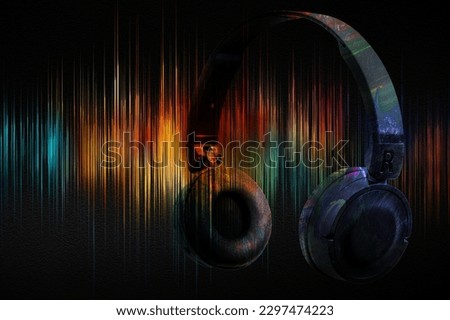 Music headphones on the background of sound wave with spectral colours. Abstract image of musical equalizer. 