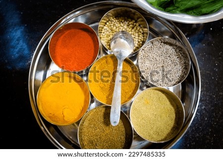 Traditional way of preparing indian food - fresh herbs and spices. Picture of traditional India cooking class in Goa