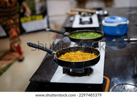 Traditional way of preparing indian food using gas pan. Picture of traditional India cuisine made of fresh ingredients taken during cooking class in Goa
