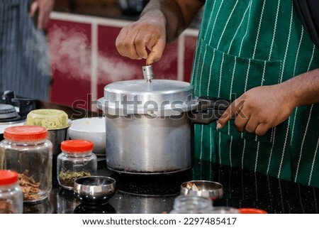 Traditional way of preparing indian food aloo gobi (potatoes with cauliflower) using gas pan. Picture of traditional India cuisine made of fresh ingredients taken during cooking class in Goa