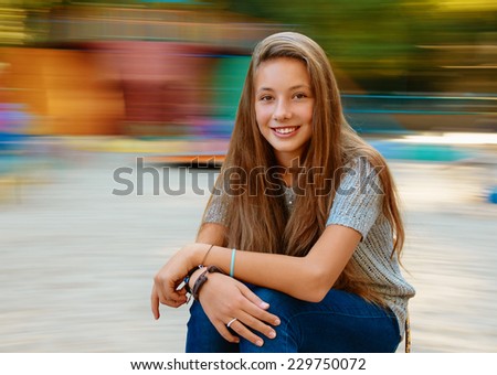 Beautiful girl in autumn. background with natural motion blur