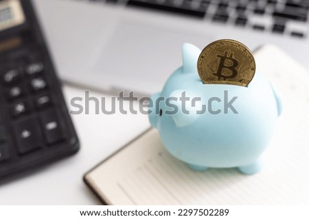 Golden Cryptocurrency bitcoin in a cute piggy bank. Business and Finance, savings, Future finance, cryptocurrency trading and investment concept