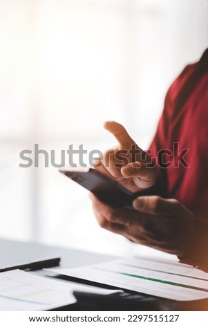 Close up holding a smartphone, typing messages, chatting with friends on social networks. The concept of using mobile applications. Shop online, surf the web, order food.