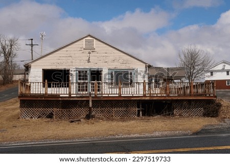 Abandoned and neglected property photographed in the winter season.  Royalty-Free Stock Photo #2297519733