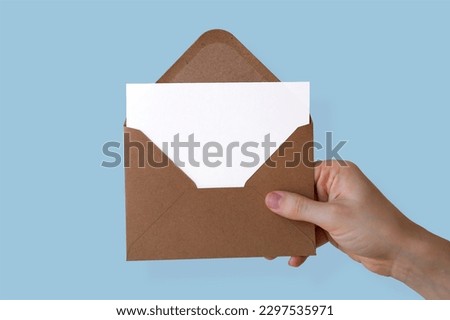 Enveloped Paper Holded by Hand