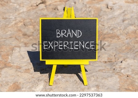 Brand experience symbol. Concept words Brand experience on black chalk blackboard on a beautiful stone background. Business branding and brand experience concept. Copy space.