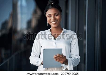 Im right on time with the goal. an attractive young businesswoman standing alone outside and using a digital tablet during the day.