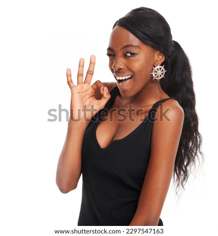 Wink, okay and emoji with portrait of black woman for like, thank you or support. Success, yes and feedback with girl and hand gesture for agreement, vote and smile isolated on white background