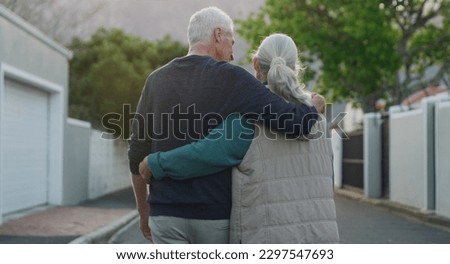A walk outside is all we needed. a senior couple walking down the street outside with their arms around each other. Royalty-Free Stock Photo #2297547693