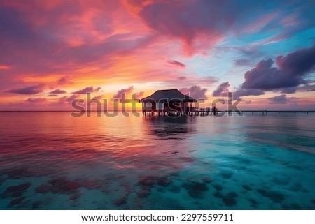 a wooden beach hut perched in the water against a stunning pink sunset. Royalty-Free Stock Photo #2297559711