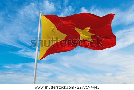 flag of Ethiopian Semitic peoples Tigrayans at cloudy sky background, panoramic view. flag representing extinct country,ethnic group or culture, regional authorities. copy space. 3d illustration Royalty-Free Stock Photo #2297594445