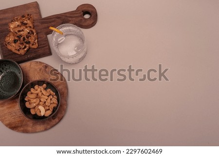 Modern flat lay design of drinks and nibbles, neutral background -Prosecco and sparkling wine apertivo  Royalty-Free Stock Photo #2297602469