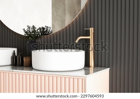 Beige bathroom interior with double sink and mirrors, carpet on concrete floor, bathtub, shower area, plants. Bathing accessories and window in hotel studio. 3D rendering	