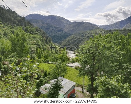 This is the beautiful picture of green trees on the mountains of Kashmir. You can see hill view of green trees along side river beautiful greenery seen with mountains