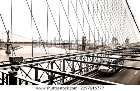 Traditional American school bus crosses a bridge to Manhattan