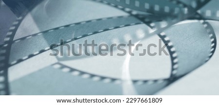 background with shadows from the film strip on a gray background .abstract background baner with film strip and shadows.gray background with beautiful shadows from the film strip.