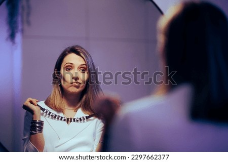 
Woman Trying to Match Appropriate Jewelry to her Blazer Dress. Elegant lady deciding how to accessorize her elegant outfit 
 Royalty-Free Stock Photo #2297662377