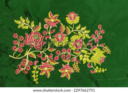 Computer embroidery flower design on green fabric beautiful and attractive  