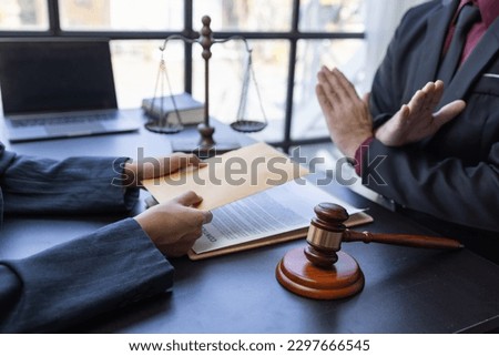 Corruption and Bribery,Businessman manager refusing receive money from Business man passing money dollar bills to deal contract.Corruption and anti bribery concept. Royalty-Free Stock Photo #2297666545