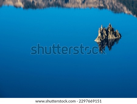 Phantom Reflection In Crater Lake surface in summer Royalty-Free Stock Photo #2297669151