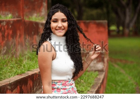latin, brazilian girl beautiful young shy curly hair, outdoors, model, commercial, beauty, fashion, brand