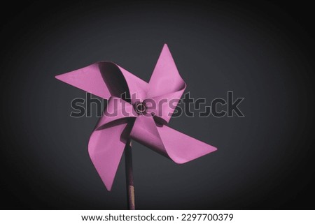 purple pink pinwheel with vintage background Royalty-Free Stock Photo #2297700379