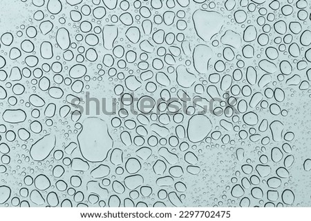 drops of water on the sunroof of a car