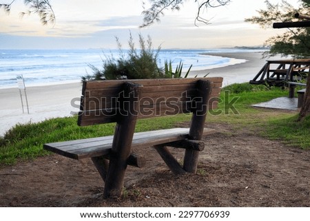 wood bench on the beach caled Praia Da Vila in Imbituba - SC