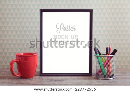 Poster mock up template with coffee cup on wooden table