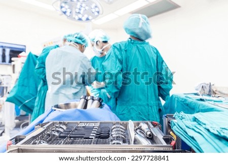 Medical total or unilateral knee joint replacement instrument tray inside operating room with blur background.A team of doctor or surgeons did arthroplasty surgery technology.Medical and orthopedic. Royalty-Free Stock Photo #2297728841