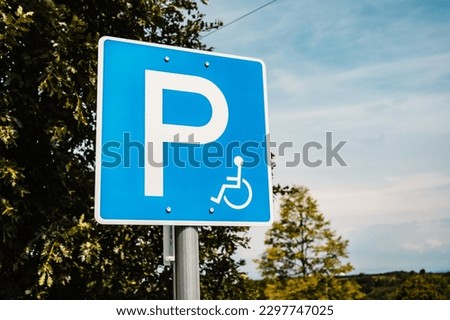 Blue Parking sign for cars on the road. handicapped parking spot